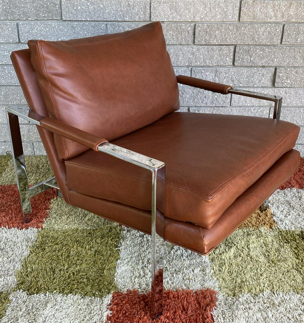 MILO BAUGHMAN FOR THAYER COGGIN CHAIR: SIGNED. CHROME WITH RUST COLORED LEATHER. TWO AREAS OF SEPERATION OF BACK PAD LEATHER TO BACKING. GOOD CONDITION.