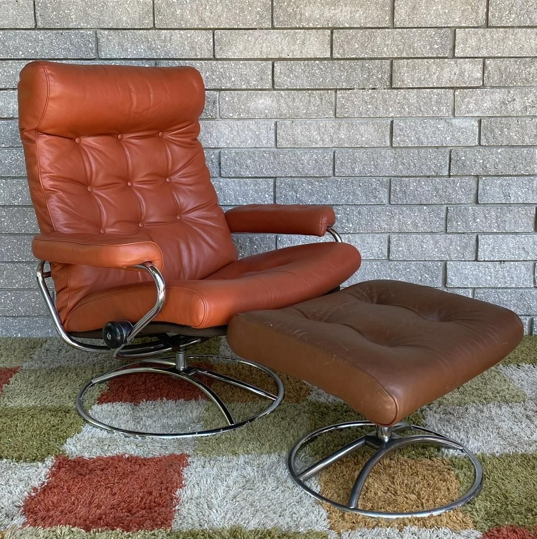 VINTAGE EKORNES LOUNGE: MIS-MATCHED CHAIR WITH OTTOMAN, BOTH IN GOOD CONDITION WITH BRIGHT CHROME STRUCTURE.