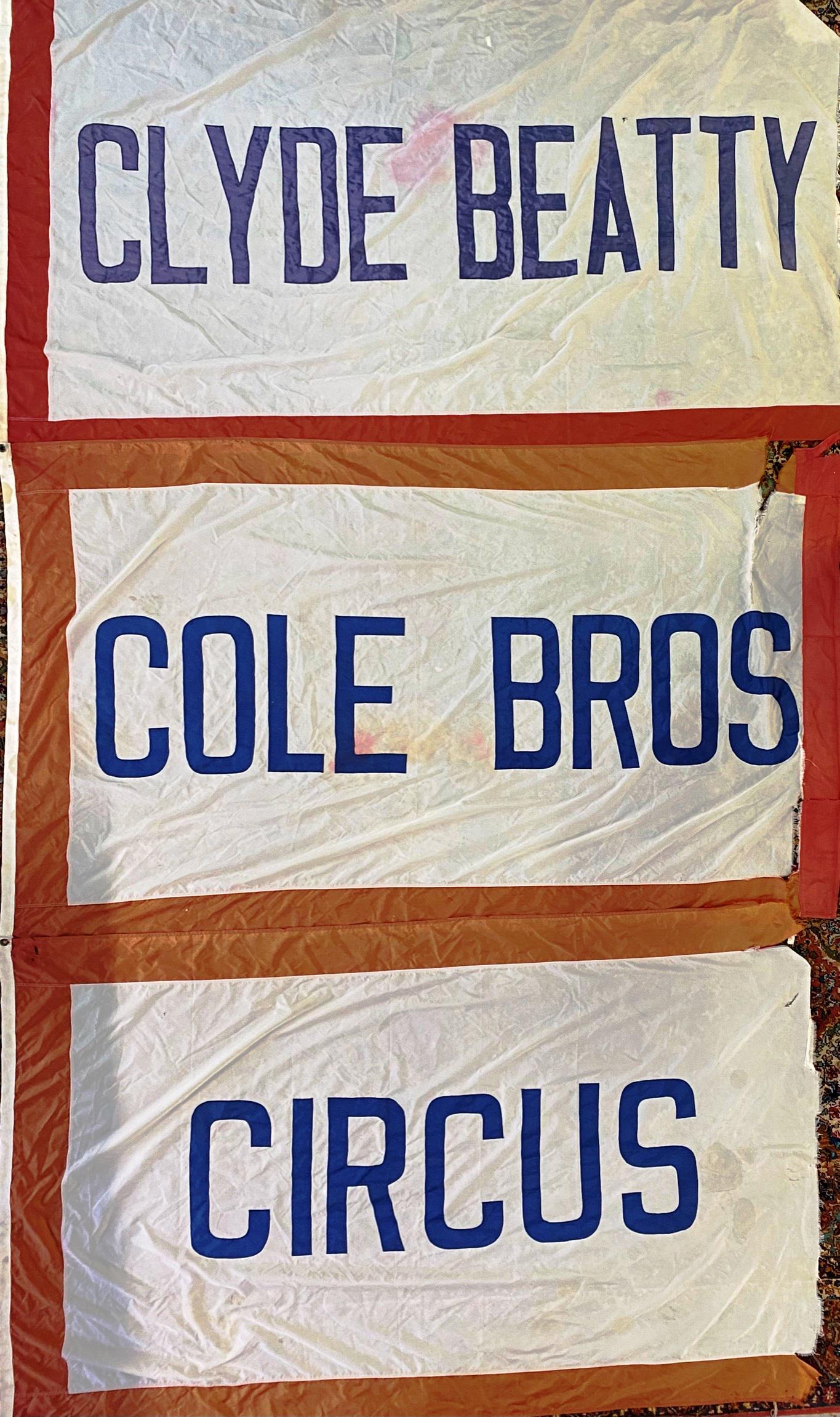 CLYDE BEATTY - COLE BROS. CIRCUS TENT FLAGS: THREE INDIVIDUAL FLAGS WHICH WOULD HAVE TOPPED THE TENT. ALL WITH SOME FORM OF WEAR CONSISTENT WITH AGE AND USE. EACH FLAG APPROX. 56"X90"