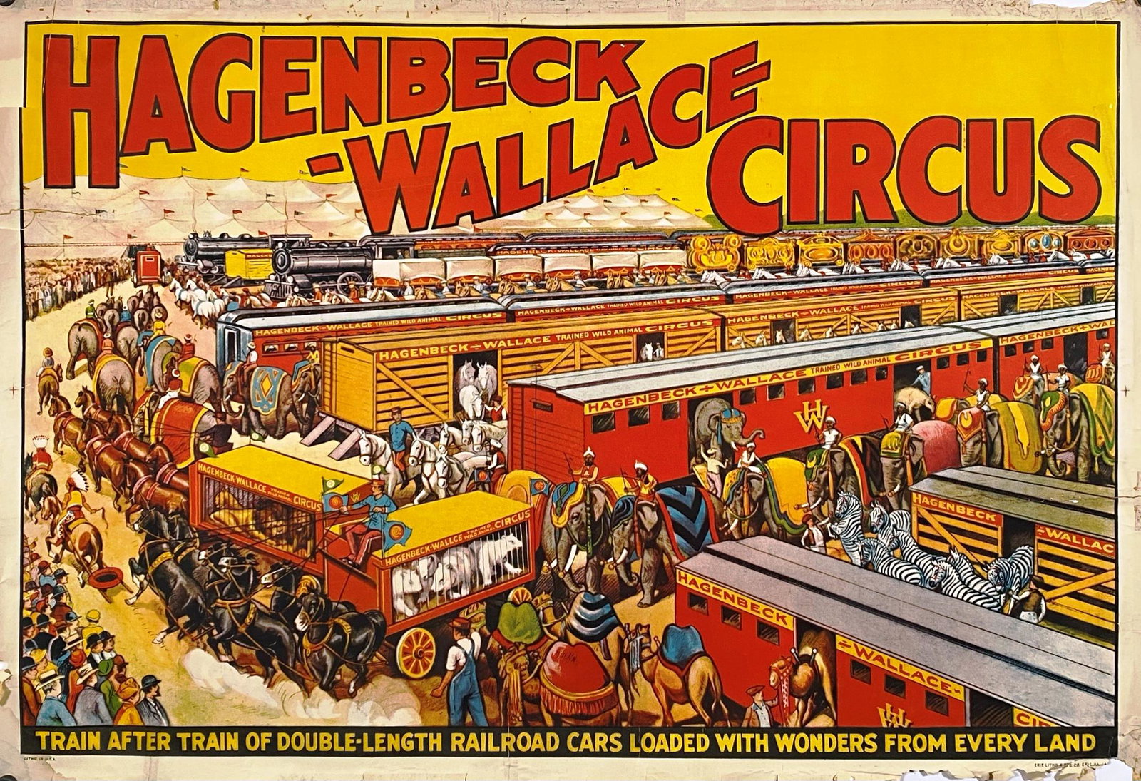 HAGENBECK-WALLACE CIRCUS POSTER: ERIE LITHO, ONE SHEET, 1934. TRAIN YARD WITH BIG TOP IN BACKGROUND. TRAIN AFTER TRAIN OF DOUBLE-LENGTH RAILROAD CARS LOADED WITH WONDERS FROM EVERY LAND. MARGIN WEAR, TAPE ON VERSO. 28"X41"