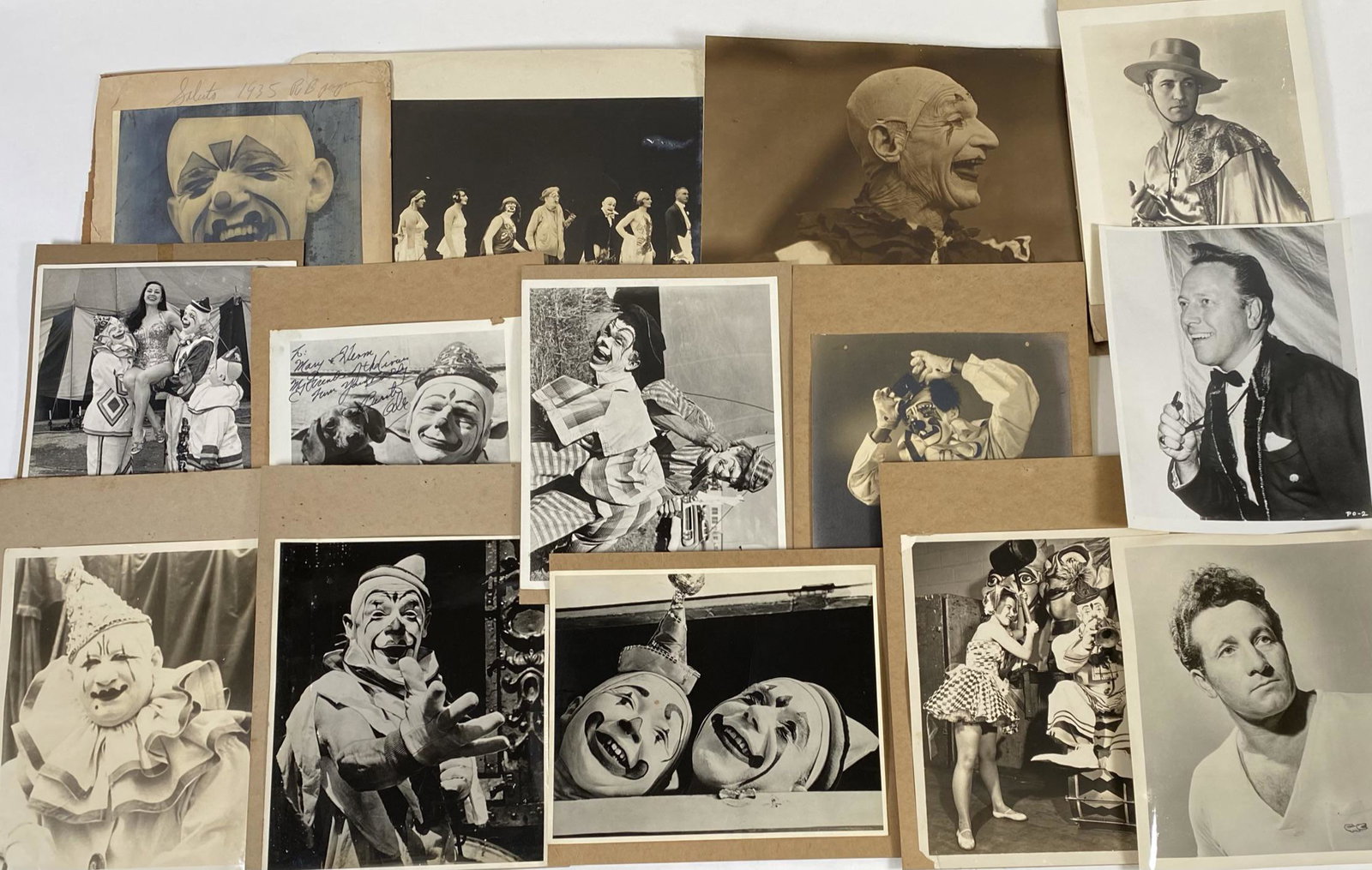 COLLECTION OF CIRCUS PHOTOGRAPHS: CLOWNS AND OTHER PERFORMERS. MANY MOUNTED TO BOARD. 8"X10"