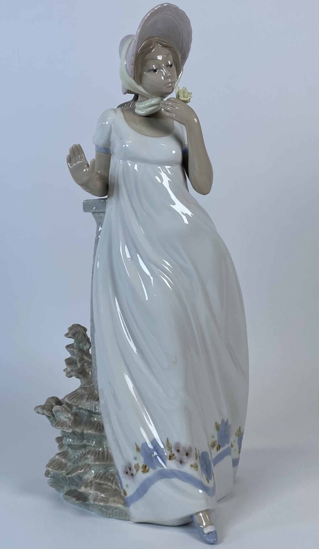 LLADRO-NAO "GIRL WITH FLOWER": 17"H. NO BOX. WE DO NOT SHIP LLADRO PORCELAIN IN HOUSE. THIRD PARTY MUST SHIP. QUOTES IN ADVANCE OF BIDDING ARE RECOMMENDED. LOCAL PICK UP AVAILABLE.