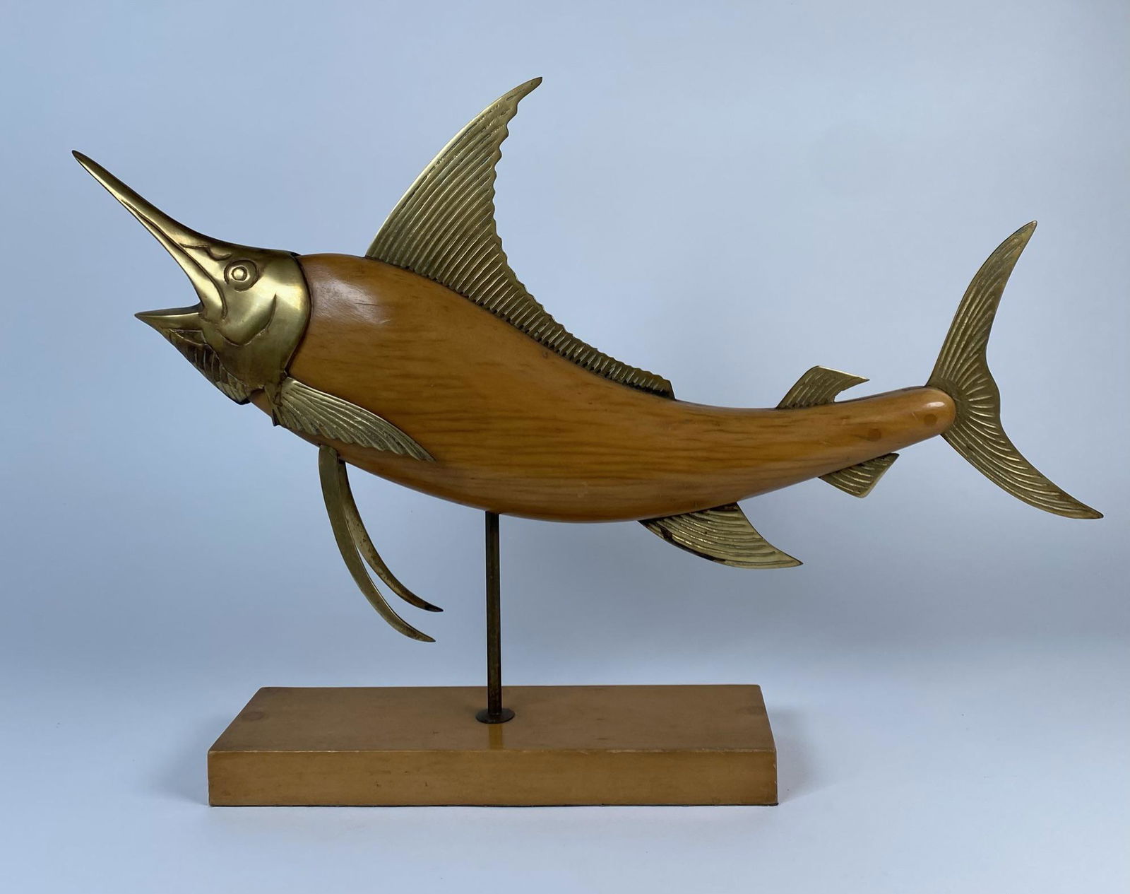 FREDERICK COOPER FISH SCULPTURE: WOOD WITH BRASS ELEMENTS. 24"L, 15.5"H