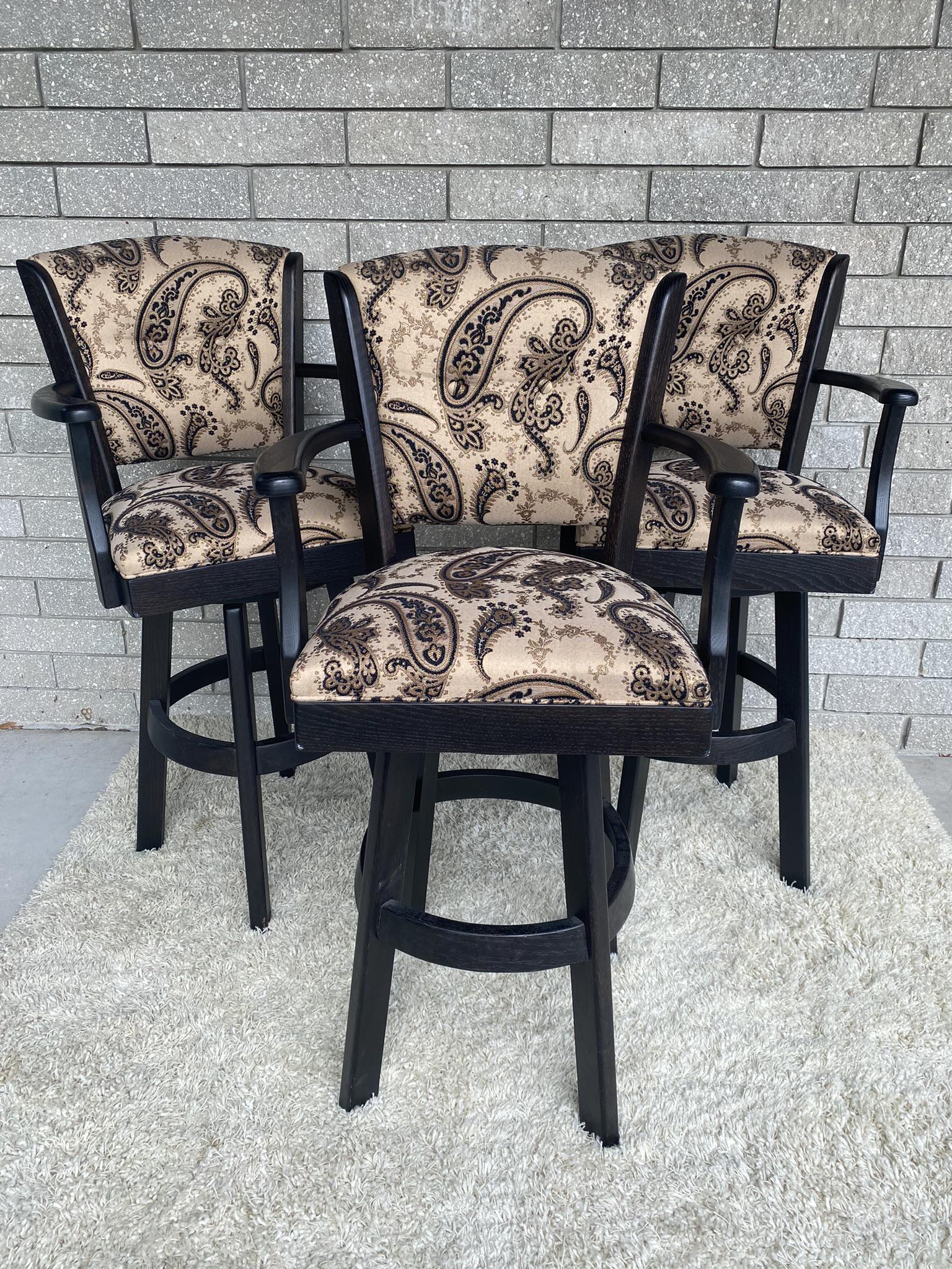 AMISH-MADE BARSTOOLS: TRIO OF AMISH MADE SWIVEL BARSTOOLS WITH EBONIZED WOODEN FRAME AND PAISLEY PRINT UPHOLSTERY. EXCELLENT