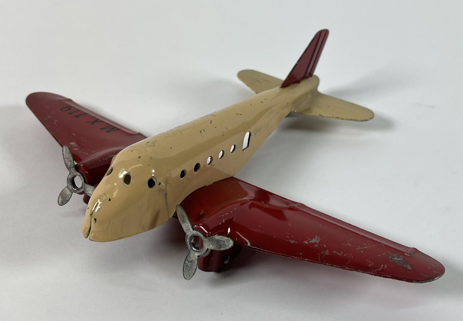 MARX PRESSED STEEL TOY AIRPLANE: ORIGINAL CONDITION, WOODEN WHEELS. 8"L