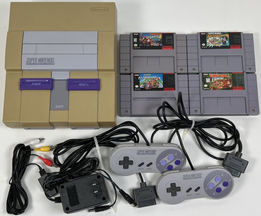 1991 SUPER NINTENDO ENTERTAINMENT SYSTEM: INCLUDES CONSOLE, 2 CONTROLLERS, POWER SUPPLY AND 4 GAMES: DONKEY KONG COUNTRY ORIGIAN AND 3, SUPER MARIO ALL-STARS, SUPER MARIO KART. TESTED IN WORKING CONDITION.