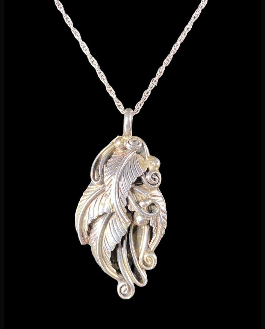 ROBERT KELLY NAVAJO PENDANT NECKLACE: STERLING SILVER PENDANT (SIGNED) ON STERLING SILVER NECKLACE. 9 GRAMS. PENDANT IS 1.5"X.75"
