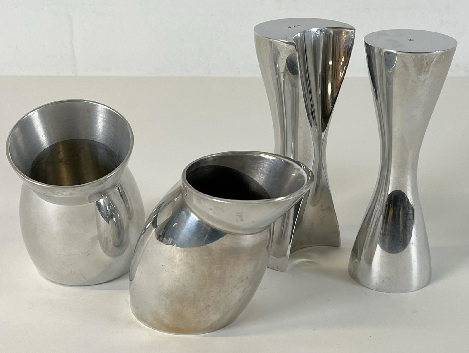 KARIM RASHID FOR NAMBE TABLE ITEMS: SALT AND PEPPPER SHAKERS, SUGAR AND CREAMER VESSELS.