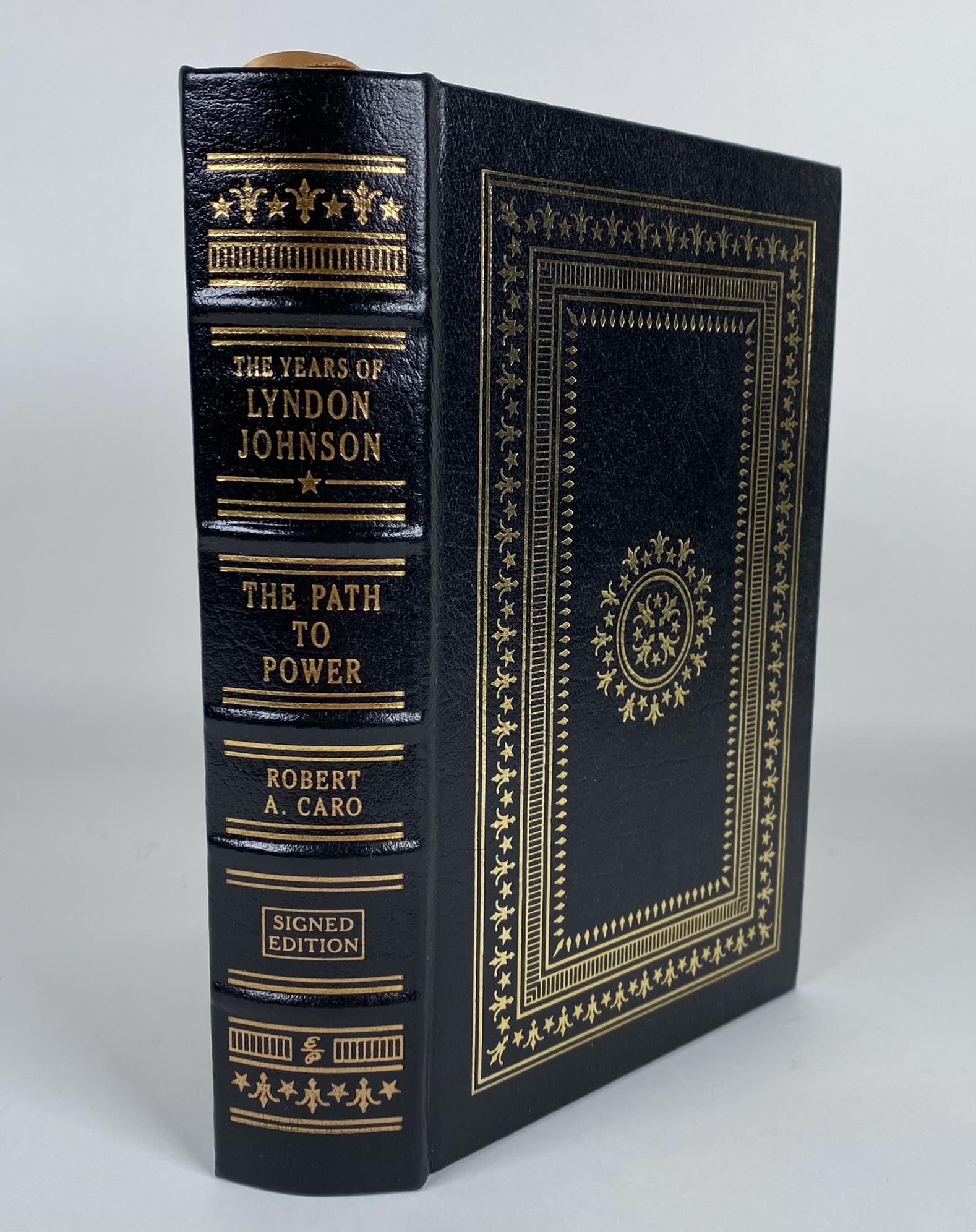 EASTON PRESS "THE YEARS OF LYNDON JOHNSON": ROBERT CARO, "THE YEARS OF LYNDON JOHNSON: THE PATH TO POWER". SIGNED BY THE AUTHOR. FINE, LEATHER BOUND BOOK, EASTON PRESS.