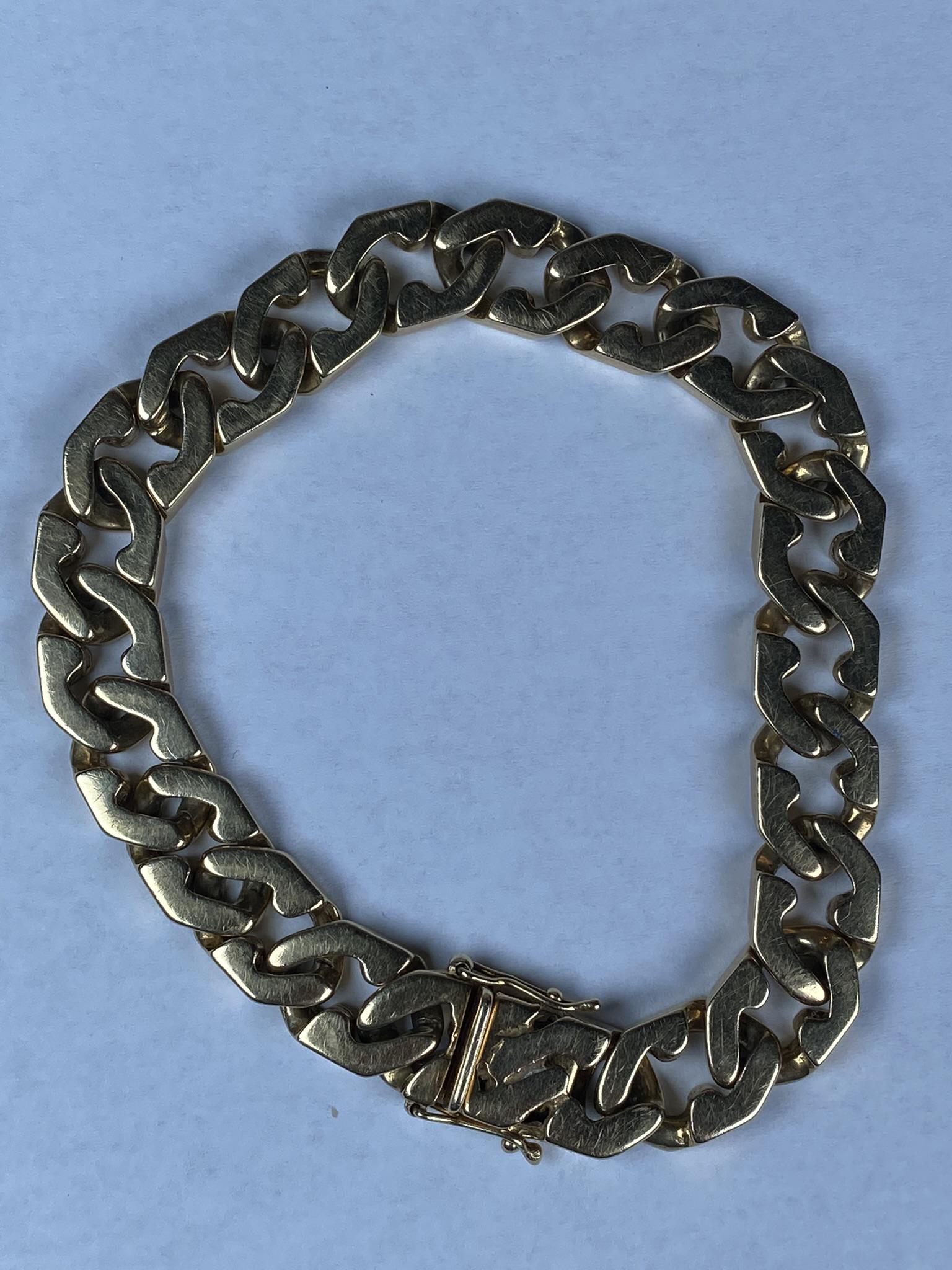 14K GOLD CUBAN LINK BRACELET: FANCY ITALIAN STYLE BRACELET. 9". 66 GRAMS