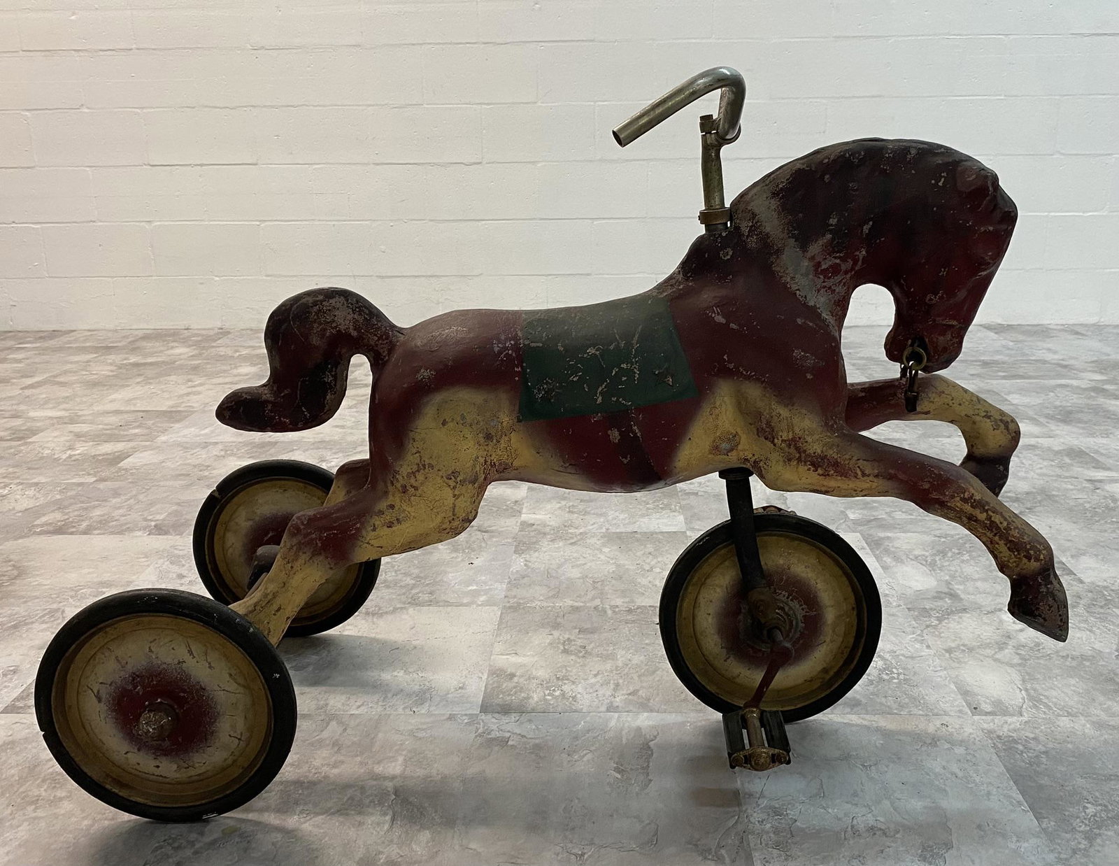 HORSE TRICYCLE WITH METAL HORSE.: HORSE TRICYCLE WITH METAL HORSE. CASTING AS STOUT AS A METAL PLAYGROUND TOY. BEAUTIFUL VINTAGE PEDAL VEHICLE FROM AN UNKNOWN MAKER.