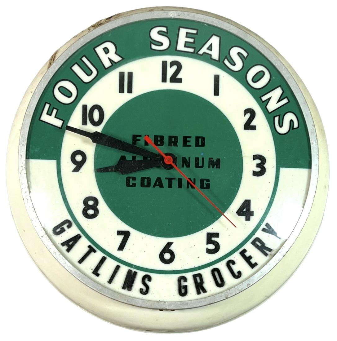 ADVERTISING - FOUR SEASONS - GATLINS GROCERY CLOCK: LIT CLOCK IN WORKING CONDITION, A FINE SPLIT IN THE 3 O'CLOCK FIELD. 15"