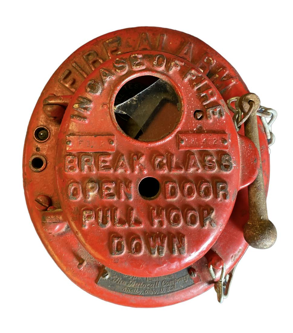 FIRE ALARM STATION: CAST IRON FIRE ALARM BOX. ORIGINAL PAINT, RETAINS ORIGINAL BATON. GLASS IS BROKEN, STATION PULLS BUT DOES NOT SOUND. 7"X8"X5"