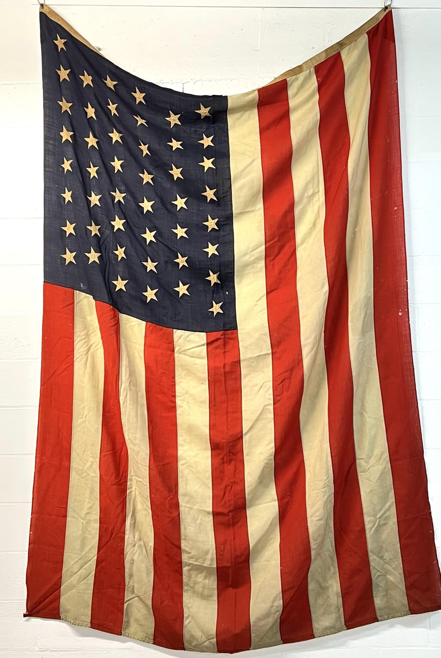 U.S. 46 STAR FLAG: LARGE U.S. FLAG HAVING 46 STARS, 1908-1912. LIGHT STAINING IN PLACES, A FEW THIN AREAS, WEAR. 103"X68"