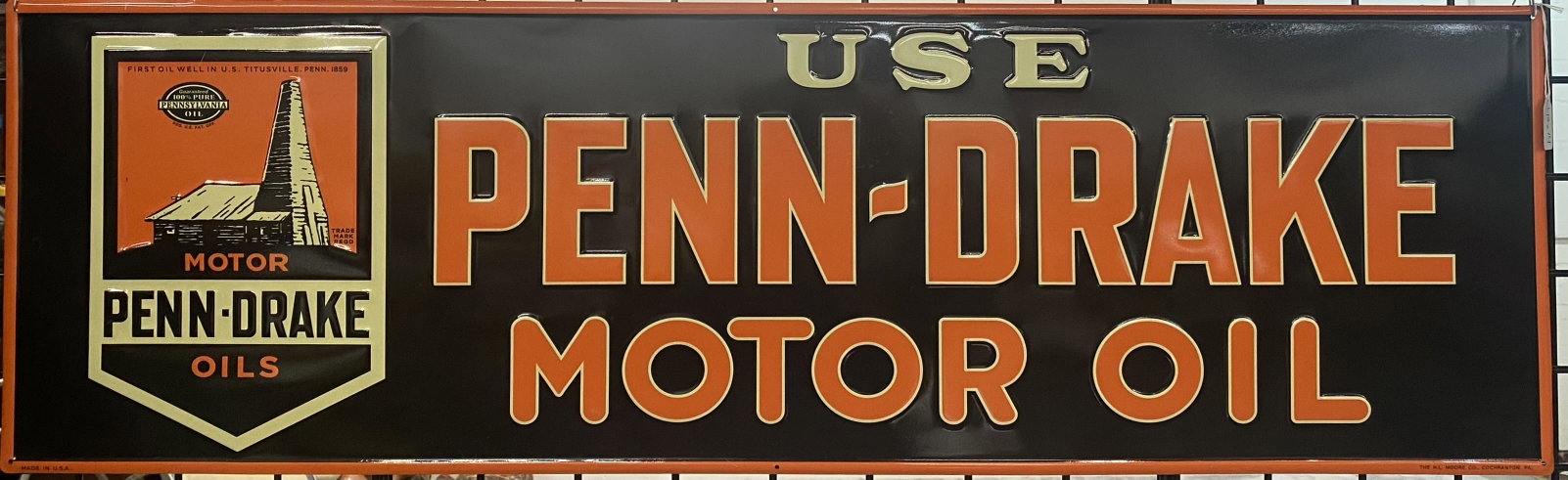 ADVERTISING - PENN-DRAKE MOTOR OILS SIGN: MADE IN U.S.A. REPRODUCTION, EMBOSSED METAL, H.L. MOORE CO. 14"X48"
