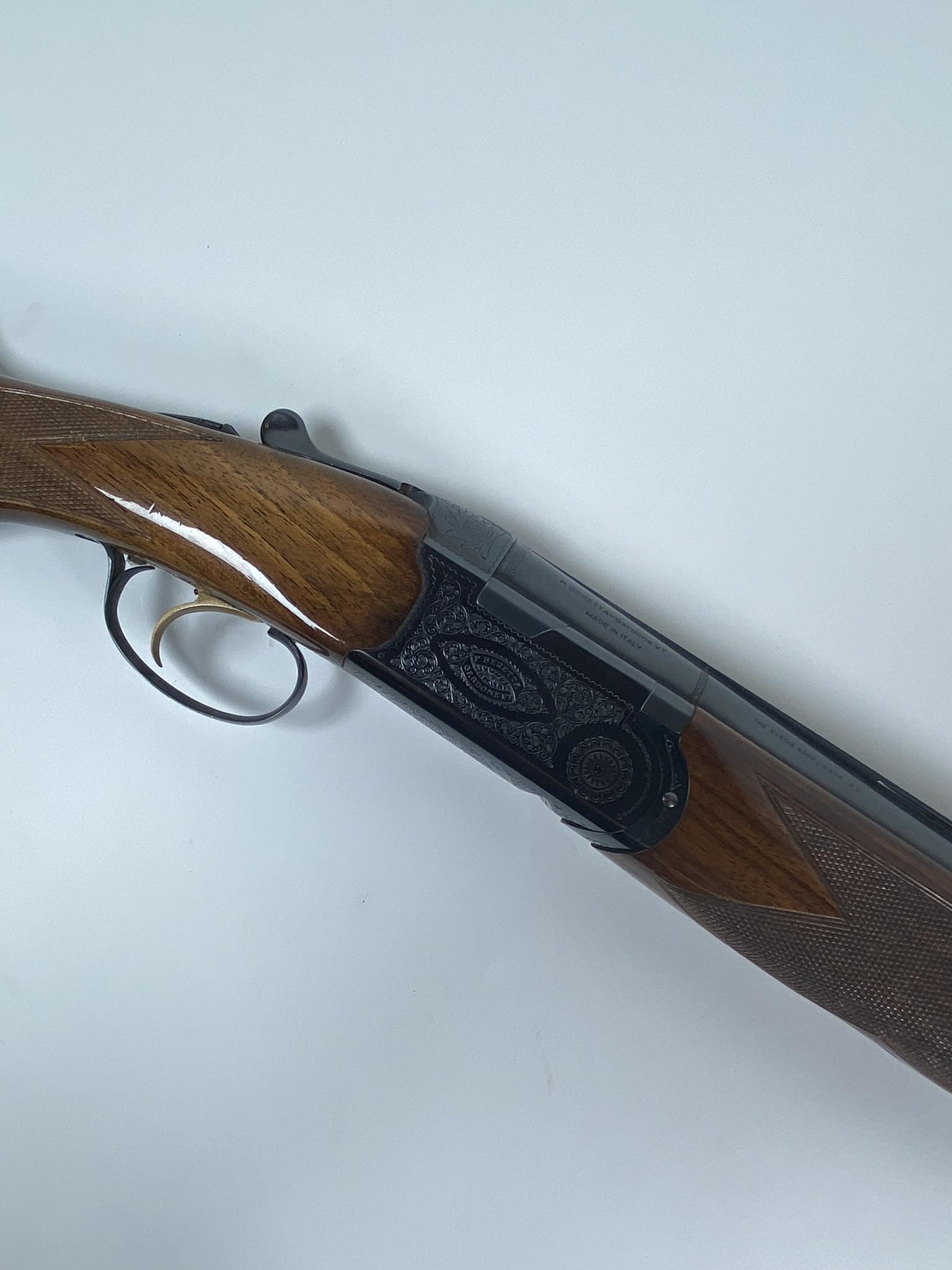 BERETTA GARDONE SHOTGUN: OVER-UNDER DOUBLE BARREL SHOTGUN, BERETTA GARDONE VT ITALY, 12 GAUGE, 30" BARREL, BL-4 MODEL. FILIGREE, SYNTHETIC STOCK, SOME PITTING TO EXTERIOR OF BARREL. SERIAL P87067. MUST SHIP TO FFL OR TRANFER 