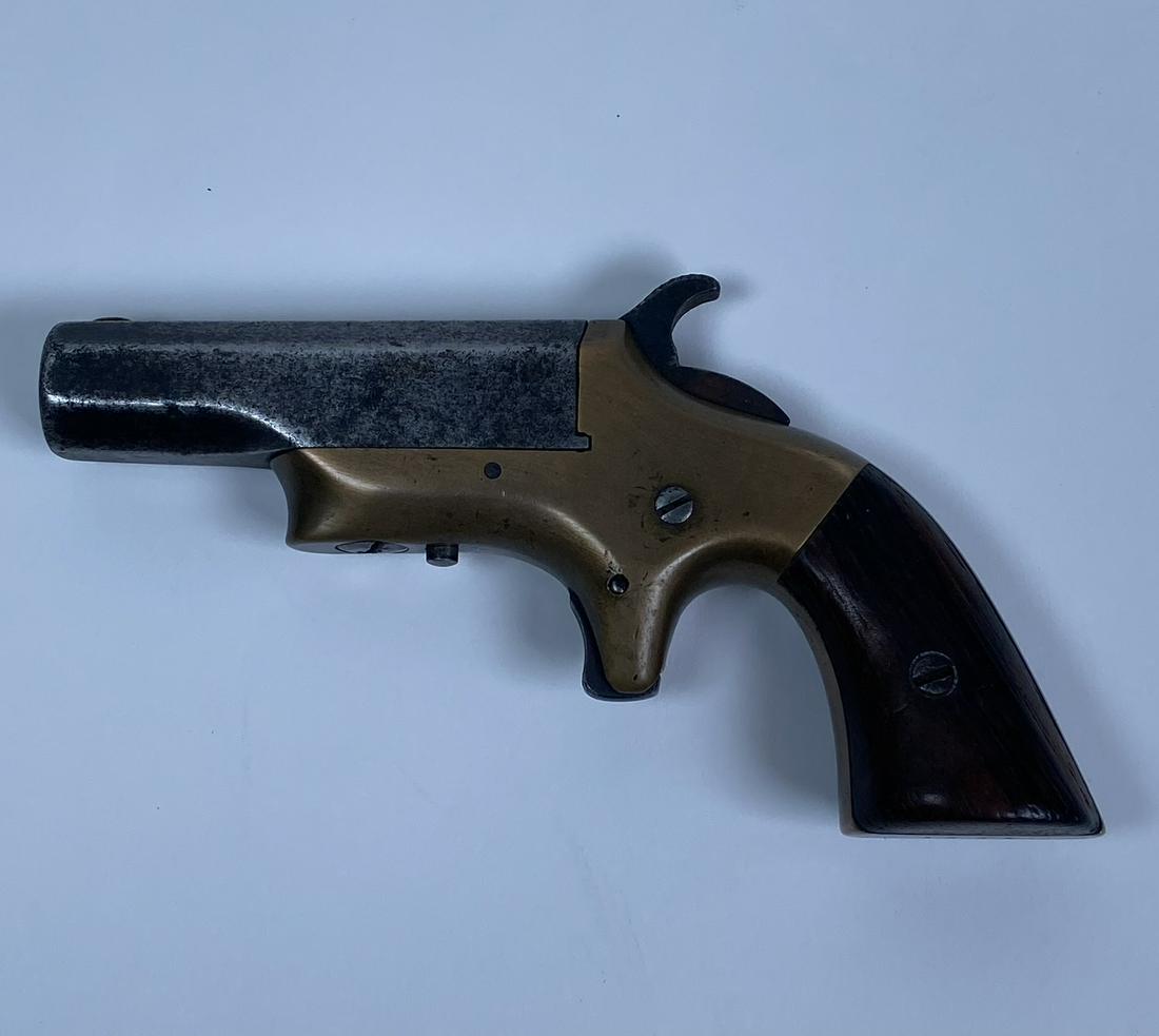 1823 DERRINGER SOUTHERNER PISTOL: BRASS FRAME, MATCHING NUMBERS, PITTING TO BARREL. SOLD AS ANTIQUE