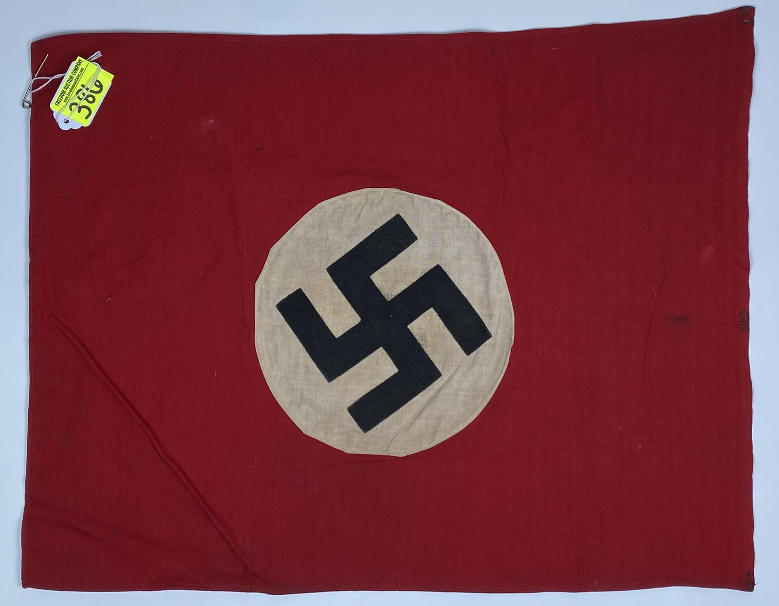 GERMAN THIRD REICH FLAG: WWII GERMAN NAZI ERA FLAG, DOUBLE SIDED, SEWN ON SILK SCREEN SWASTIKA, SIGNS OF TACKING, FINISHED AND SEAMED ON THE SIDES. UNUSUAL TO FIND IN THIS SIZE. 15"X17"
