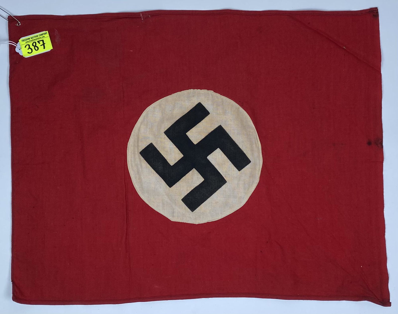 GERMAN THIRD REICH FLAG: WWII GERMAN NAZI ERA FLAG, DOUBLE SIDED, SEWN ON SILK SCREEN SWASTIKA, SIGNS OF TACKING, FINISHED AND SEAMED ON THE SIDES. UNUSUAL TO FIND IN THIS SIZE. 15"X17"