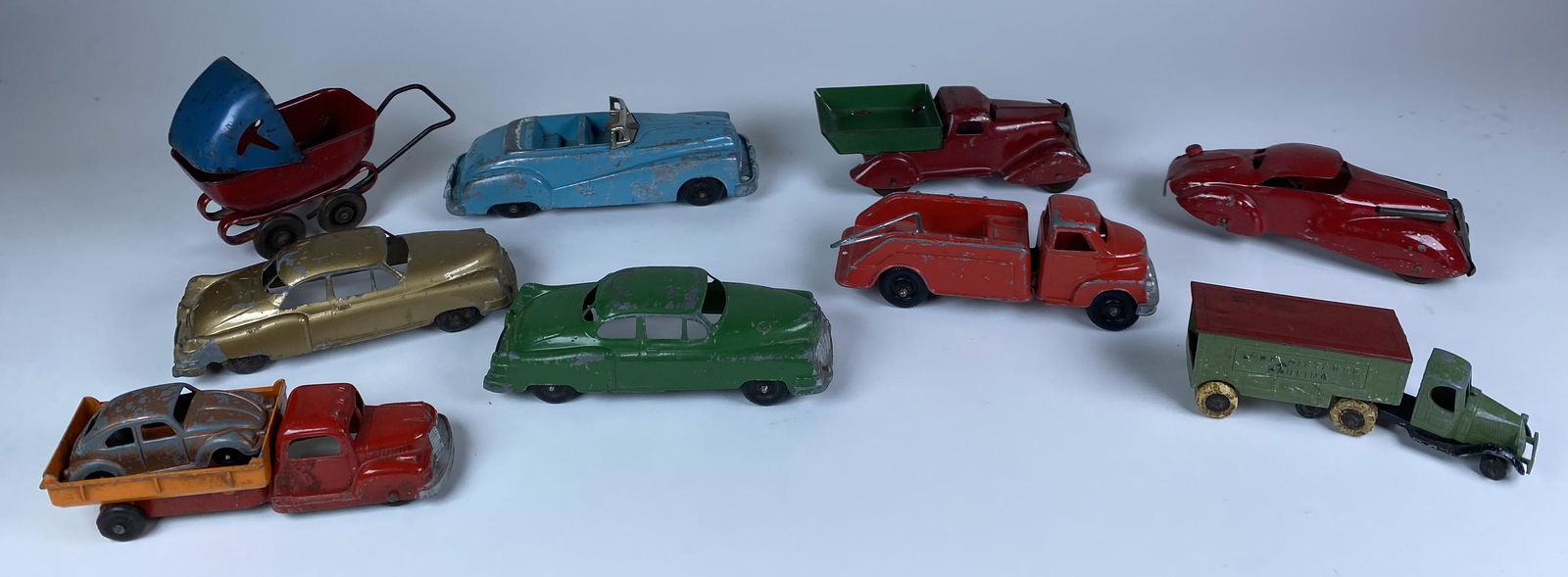 MARX AND TOOTSIETOY VEHICLES: MARX TRUCK AND LASALLE IN NICE CONDITION. WINDUP DOES NOT WORK AND TIRE IS SPLIT. STRUCTO CADILLACS ARE FOR CAR HAULER. NICE ORIGINIAL LONG HAULINIG MACK BY TOOTSIETOYS WITH NO FRONT WHEELS.