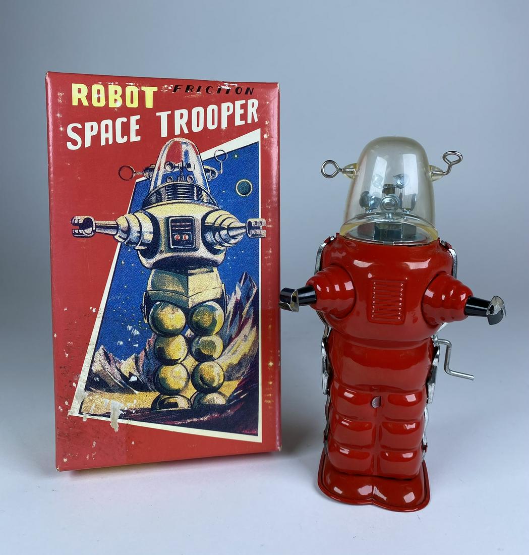 SPACE TROOPER FRICTION TIN ROBOT: ROBOT SPACE TROOPER FRICTION TIN. MORE MODERN RENDITION CA 2000S. FRICTION ANTENNA WORKS SPORATICALLY. 7" H
