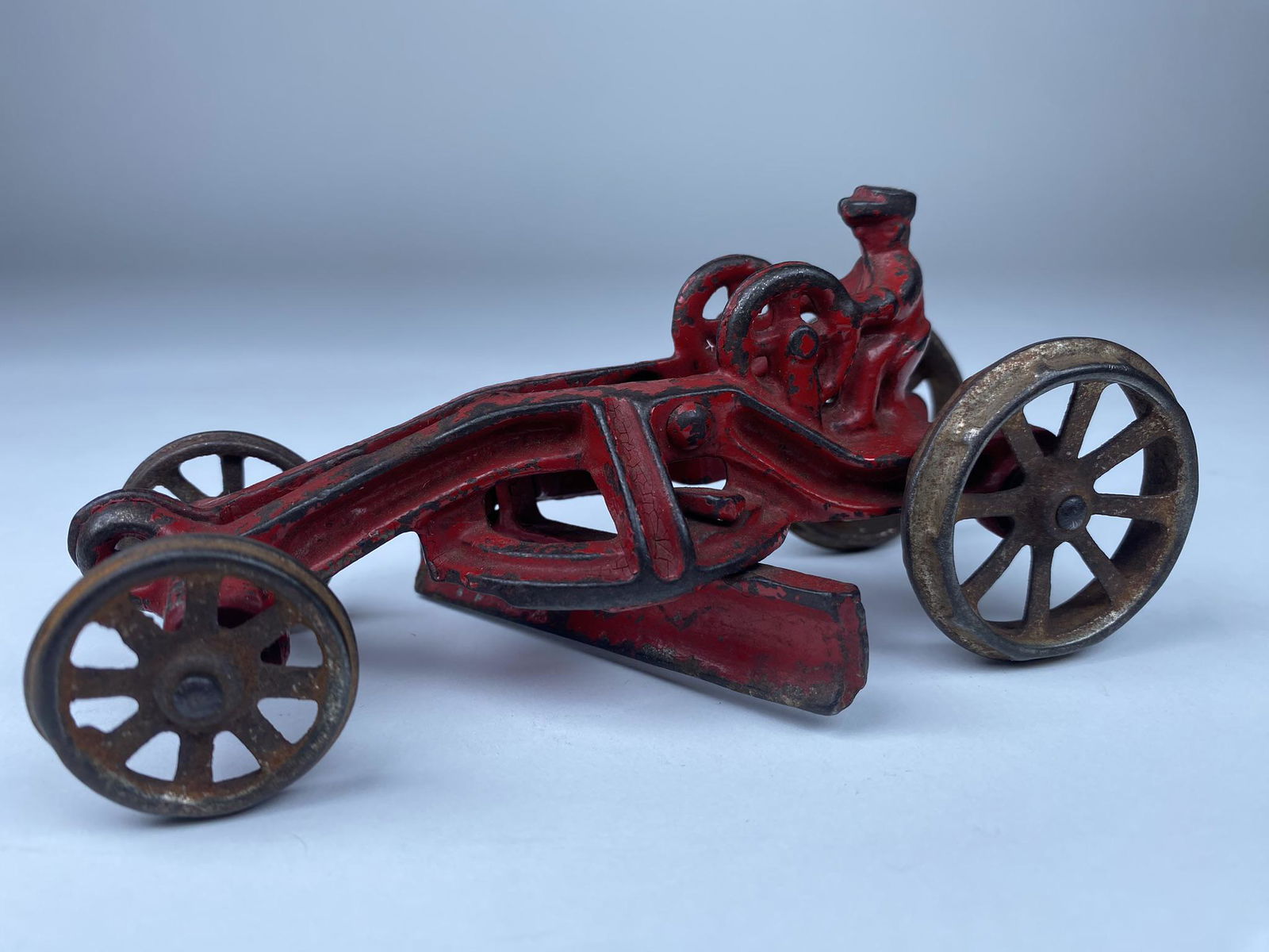 AC WILLIAMS ROAD GRADER: LARGER 6" VERSION OF THE AC WILLIAMS ROAD GRADER IN RED. NICE GRADER DETAILING IN THIS PULL TOY.