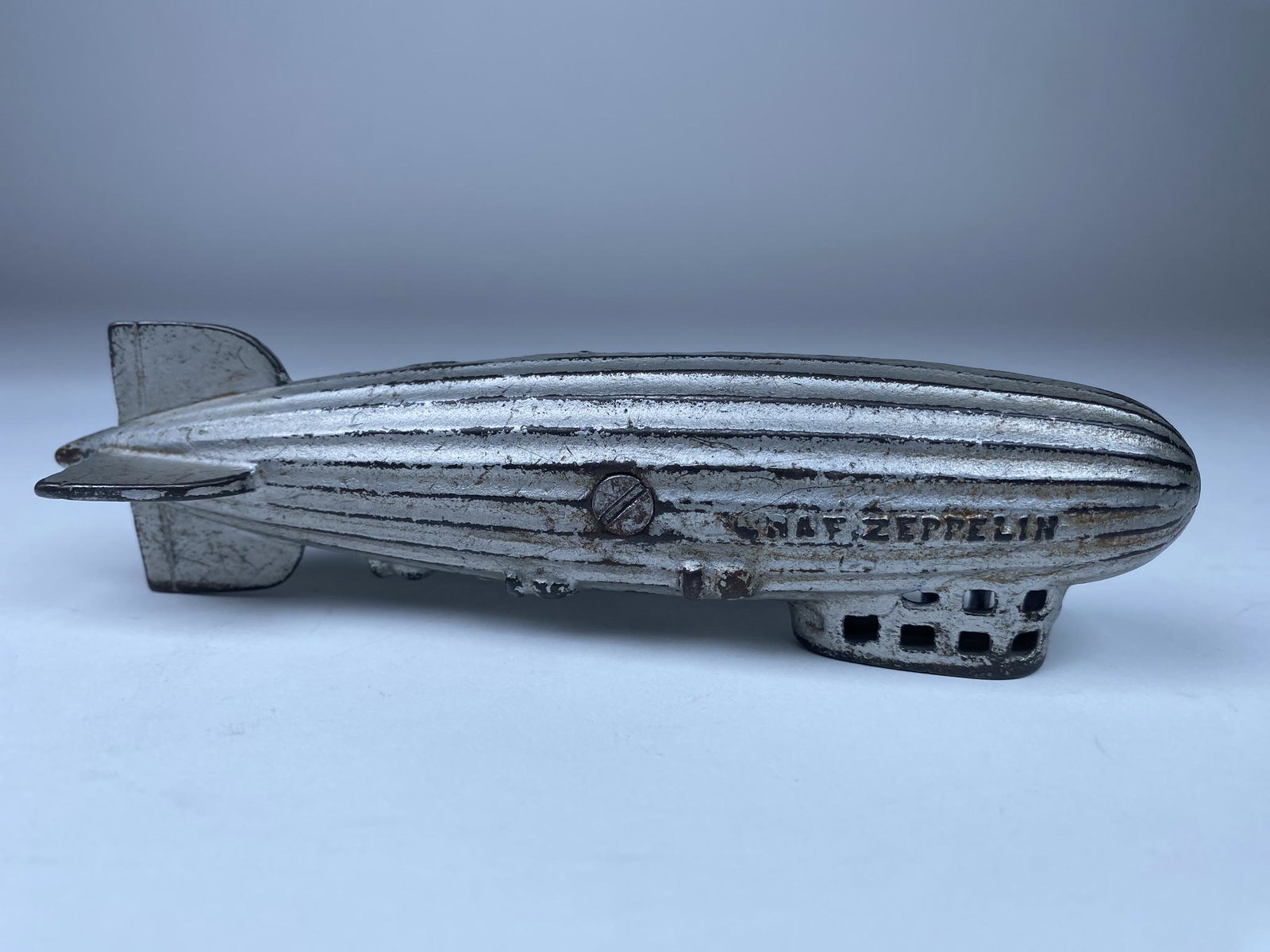 AC WILLIAMS GRAF ZEPPELIN STILL BANK: NICE CAST IRON STILL BANK BY AC WILLIAMS. ORIGINAL CONDITION C.1930. 6.5" L.