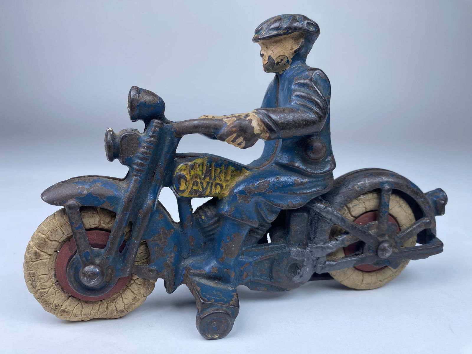 HUBLEY HARLEY DAVIDSON CIVILIAN MOTORCYCLE: CAST IRON CIVILIAN VERSION OF THE HUBLEY HARLEY DAVIDSON. WELD REPAIR TO LEFT REAR FENDER. BLUE VERSION WITH NICE REAR LICENSE PLATE.