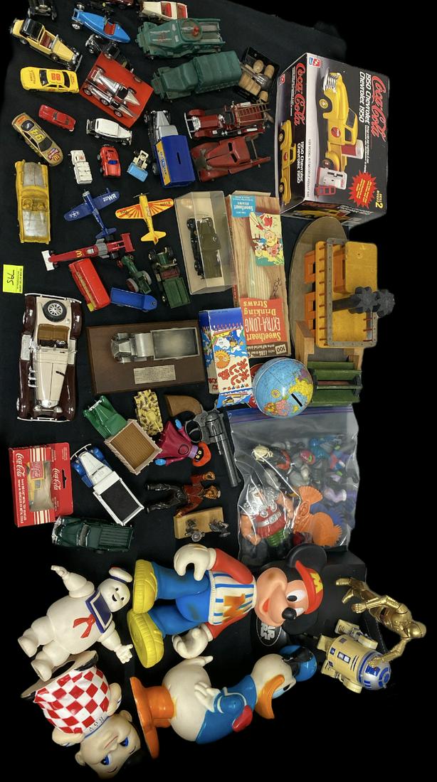 LUCKY MIX CAR, TRUCK, VINYL FIGURE HEMAN LOT: LUCKY MIX OF HEMAN FIGURES, GHOSTBUSTERS STAY PUFF, BIG BOY, MICKEY MOUSE, AND NUMEROUS DIECAST CARS AND TRUCKS. COCA-COLA MODEL AND PADDLE BOAT ARE INCLUDED.