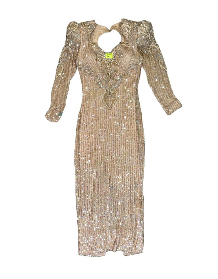 ZOPPE - SHERYLL FAMILY CIRCUS WARDROBE: SHOW GOWN WITH BLUSH SEQUINSS AND BEAD ACCENTS. SMALL-MEDIUM. THE ZOPPE - SHERYLL FAMILY HAVE BEEN ACTIVE IN CIRCUS AND SHOW PERFORMANCE FOR OVER 50 YEARS WITH FOCUS ON COMEDY ACTS, JUGGLING, BALANCE,