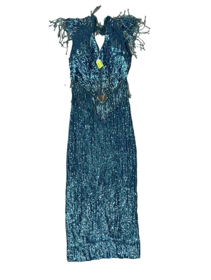 ZOPPE - SHERYLL FAMILY CIRCUS WARDROBE: TURQUOISE WITH SEQUINSS AND BEAD FRINGE SHOW DRESS. SMALL. THE ZOPPE - SHERYLL FAMILY HAVE BEEN ACTIVE IN CIRCUS AND SHOW PERFORMANCE FOR OVER 50 YEARS WITH FOCUS ON COMEDY ACTS, JUGGLING, BALANCE, RO