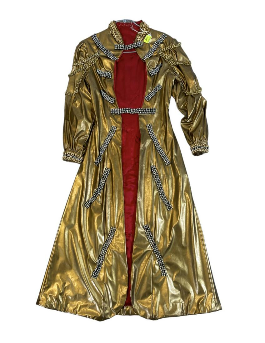 ZOPPE - SHERYLL FAMILY CIRCUS WARDROBE: CUSTOM-MADE GOLD VINYL ROBE GILT CHAIN AND RHINESTONE ACCENTS. SMALL-MEDIUM. THE ZOPPE - SHERYLL FAMILY HAVE BEEN ACTIVE IN CIRCUS AND SHOW PERFORMANCE FOR OVER 50 YEARS WITH FOCUS ON COMEDY ACTS, JUG