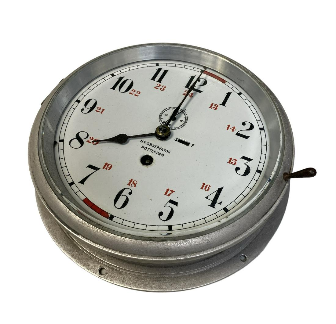 N.V. OBSERVATOR BRIDGE CLOCK: N.V. OBSERVATOR, ROTTERDAM, SHIP CLOCK. PORCELAIN FACE WITH GLASS BEZEL, ALUMINUM CASE. NO KEY, HAS NOT BEEN TESTED. 10" DIA.