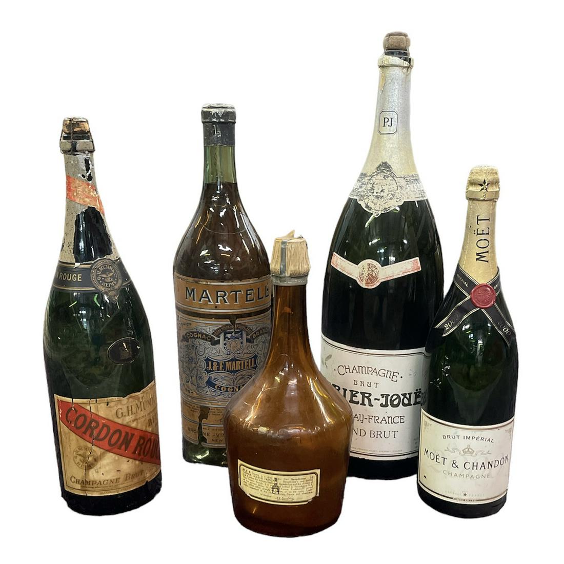 COLLECTION OF VINTAGE SPIRITS BOTTLES: 5 LARGE BOTTLES, CHAPAGNE, COGNAC AND LIQUEUR. LARGEST IS 27"H. ORIGINALLY FROM THE BUCCANEER INN, LONGBOAT KEY, FLORIDA, 1957-1992.