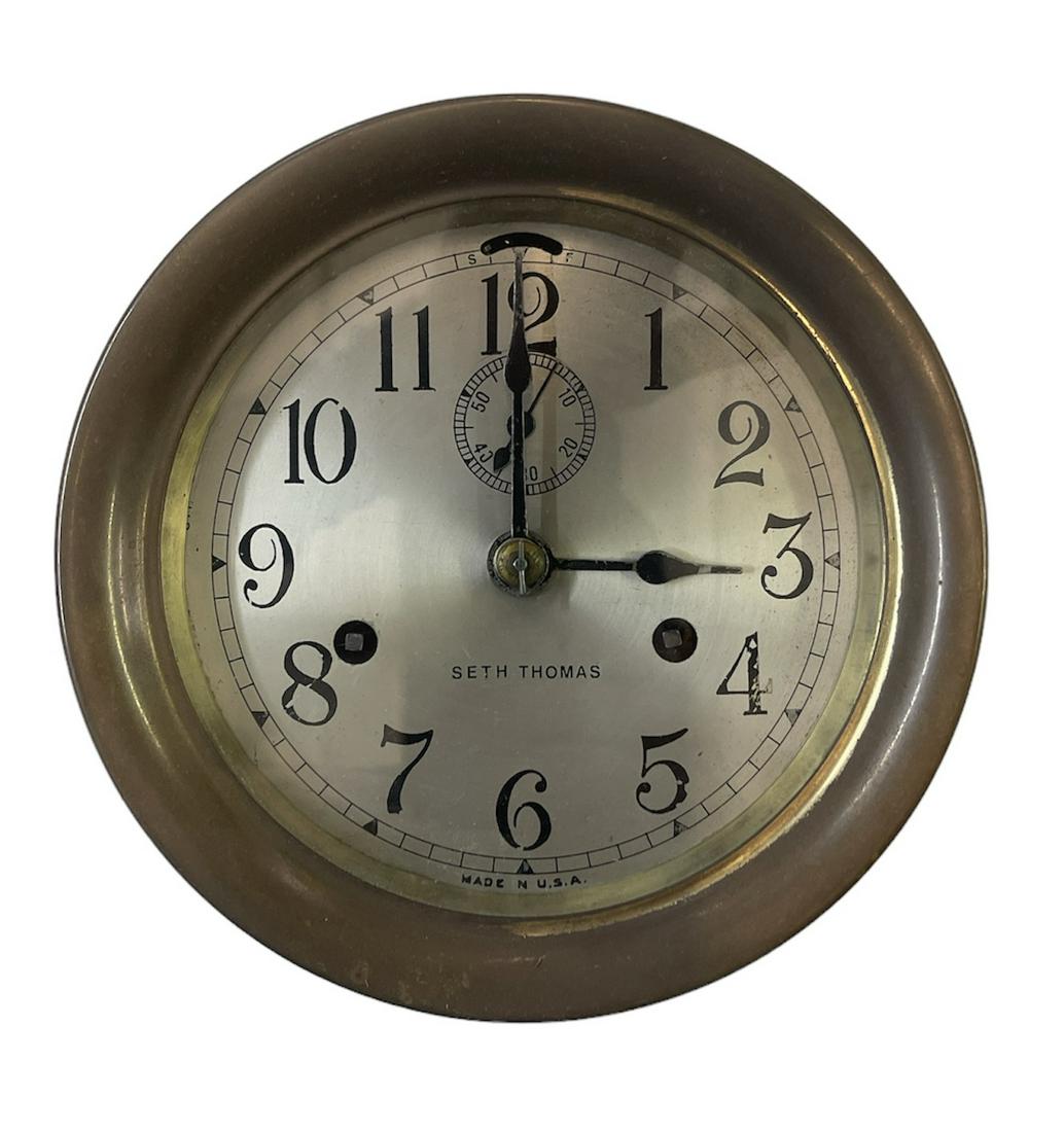SETH THOMAS SHIP'S BELL CLOCK: WITH KEY, RUNNING AT TIME OF SALE. 7" DIA.