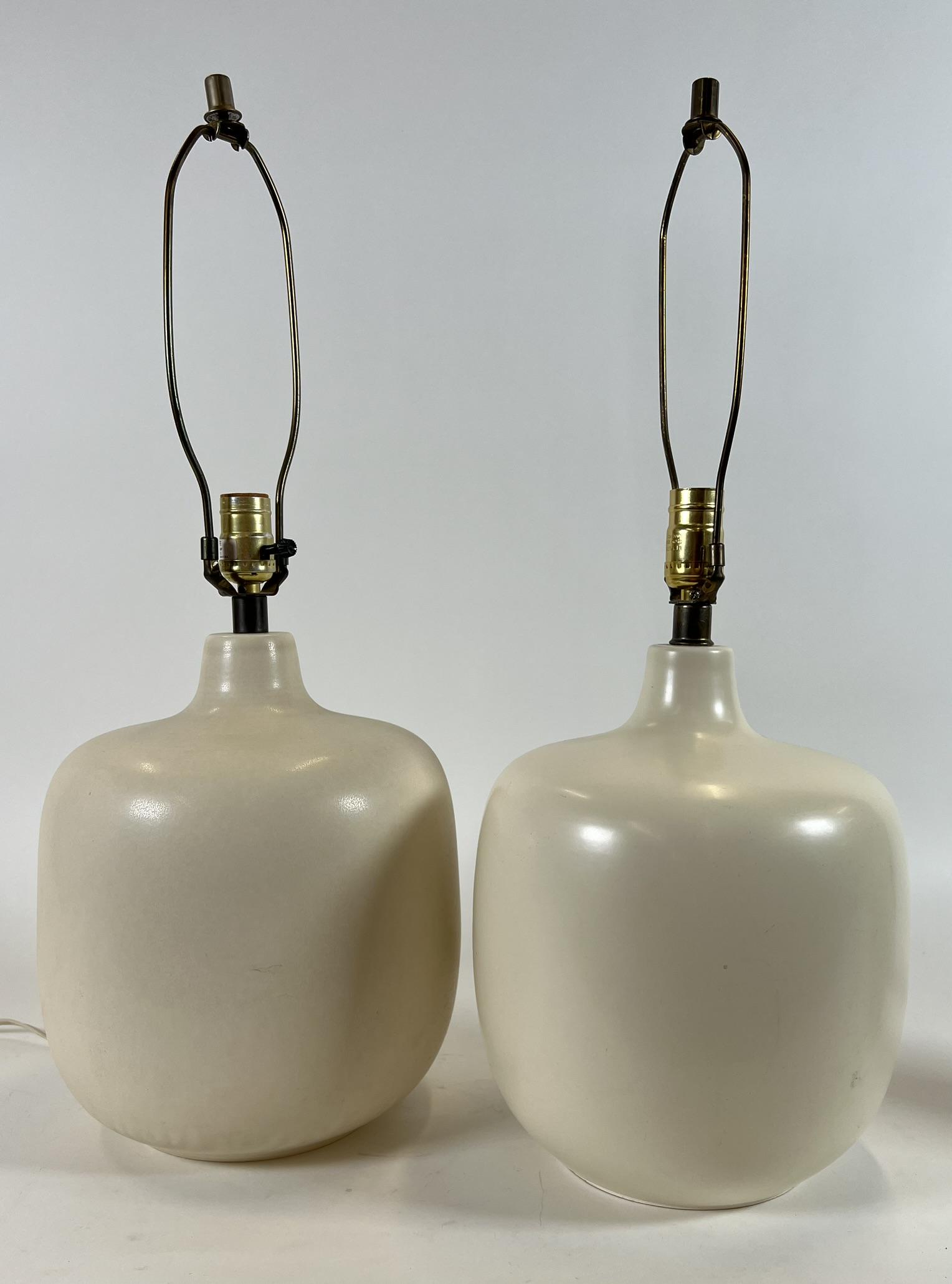 LOTTE GUNNAR BOSTLUND TABLE LAMPS: PAIR OF LOTTE AND GUNNAR BOSTLUND POTTERY SQUAT TABLE LAMPS IN IVORY WITH ORIGINAL FIBERGLASS JUTE SHADES. 16" BASE TO SOCKET
