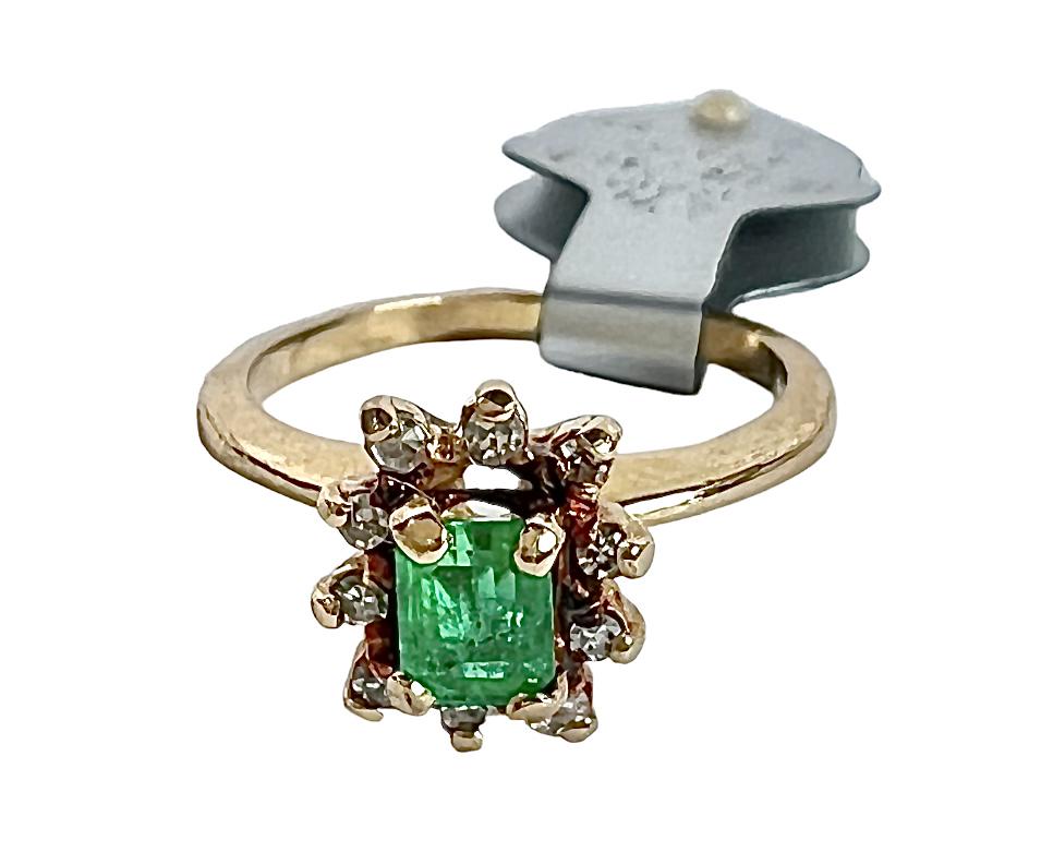 GOLD EMERALD AND DIAMOND LADIES RING: 14K YELLOW GOLD WITH EMERAL AND DIAMOND LADIES RING. 3 GRAMS, SIZE 5. APPRAISAL INCLUDED WITH SALE. PLEASE REVIEW APPRAISAL FOR ADDITIONAL DETAILS. ESTIMATED REPLACEMENT VALUE $1,050.