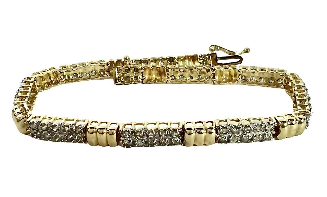GOLD AND DIAMOND BRACELET: 10K YELLOW GOLD AND DIAMOND BRACELET. 1.5 CT DIAMONDS, 9.2 GRAMS. APPRAISAL INCLUDED WITH SALE. PLEASE REVIEW APPRAISAL FOR ADDITIONAL DETAILS. ESTIMATED REPLACEMENT VALUE $2,150.