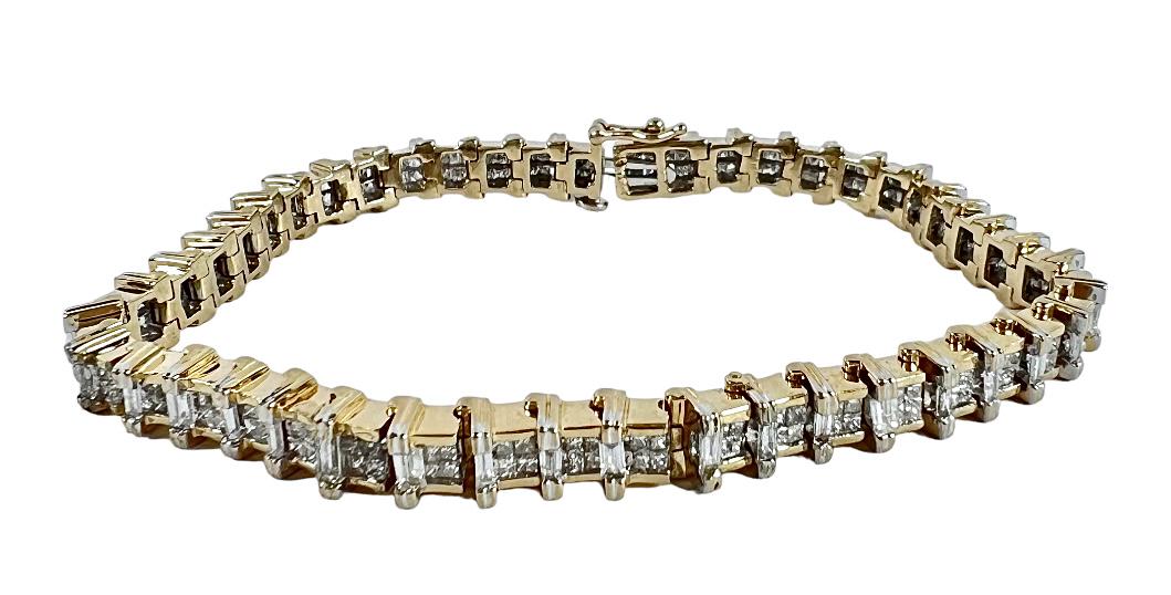 LADIES GOLD AND DIAMOND TENNIS BRACELET: LADIES 14K YELLOW GOLD WITH 5 CT. TOTAL WEIGHT DIAMOND TENNIS BRACELET CONTAINING 180 1MM SQUARE CUT DIAMONDS WITH A TOTAL DIAMOND WEIGHT OF 3.2 CTW AND 15 BAGUETTE DIAMONDS WITH A TOTAL DIAMOND WEIGH