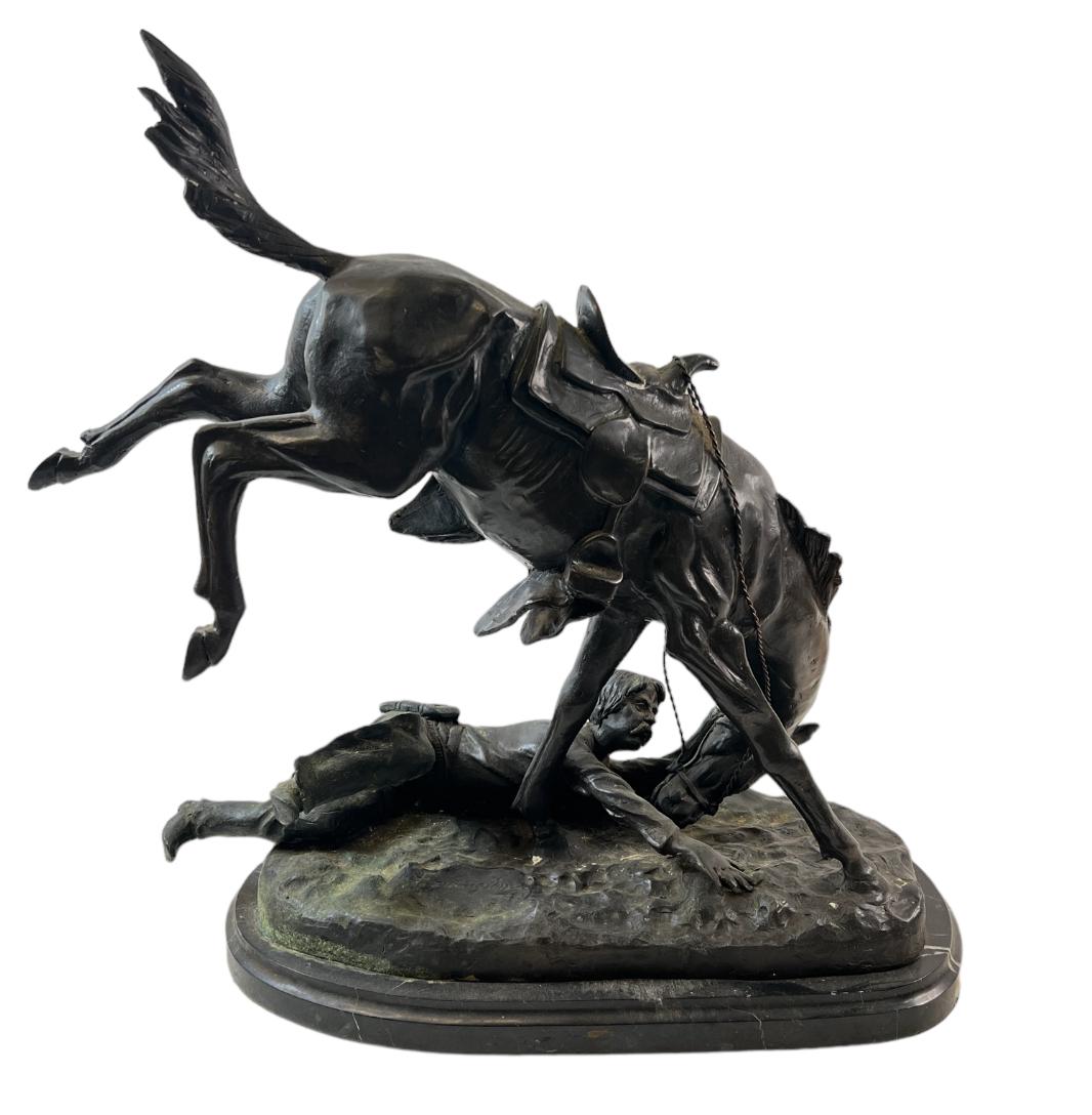 AFTER FREDERIC REMINGTON WICKED PONY: AFTER F.R. BRONZE SCULPTURE, "WICKED PONY". BRONZE ON METAL BASE. 23"H