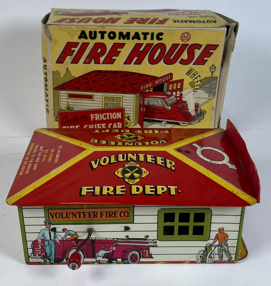 MARX TOYS AUTOMATIC FIRE HOUSE WITH CAR: ORIGINAL MARX TOY WITH BOX (HAVING WEAR). PLASTIC DOORS ARE WARPED AND NOT STAYING ATTACHED.