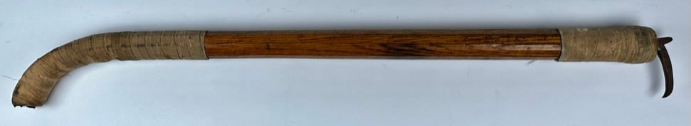 GUNTHER GEBEL WILLIAMS BULL HOOK: ELEPHANT BULL HOOK ONCE USED BY GUNTHER GEBEL WILLIAMS. TAPE AT CURVED HANDLE WITH POINTED END, "GGW" CARVED INTO THE STAFF. 26"L