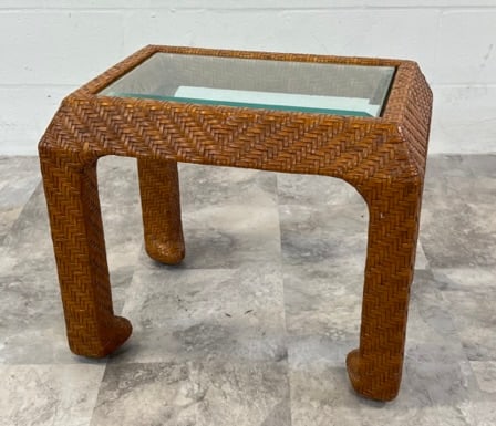 Rattan Side Table: Diminutive side table, rattan structure with glass top. 22"x16" top, 20"h