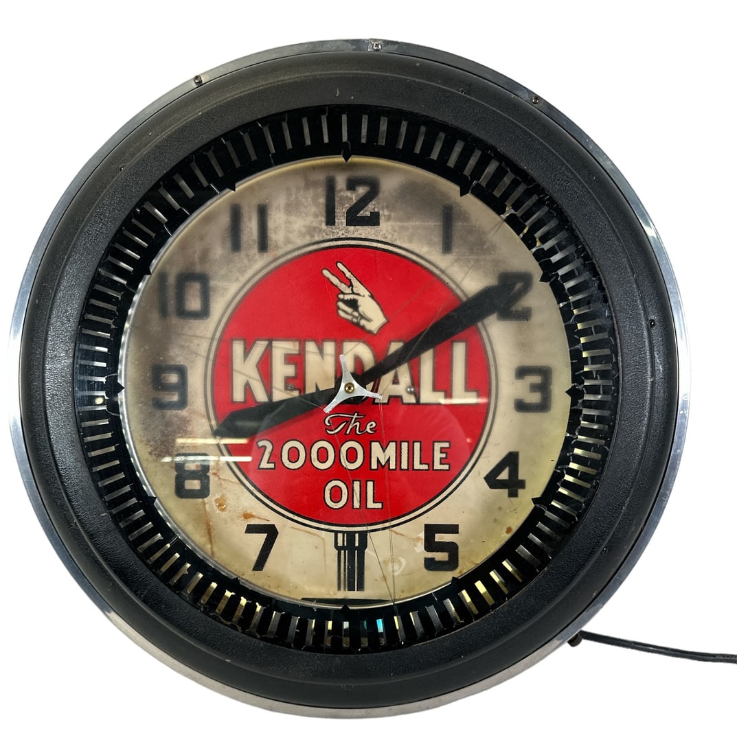 KENDALL OIL NEON SPINNER CLOCK: KENDALL OIL THE 2,000 MILE NEON SPINNER ADVERTISING CLOCK. SPOTTING AMONG THE FACE, NEON LIGHTS UP WHITE, SPINNER OPERATES. 21"