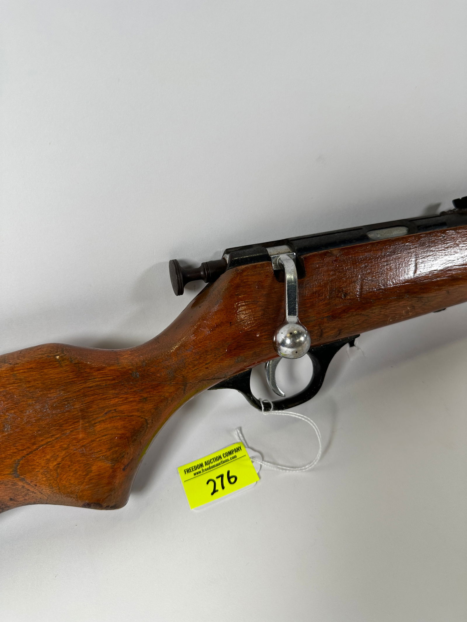 MARLIN 100 RIFLE: .22 CAL, L,S,LR. CRACKED STOCK, BOLT ACTION CYCLE BUT TRIGGER ACTION DOES NOT. SOLD AS IS.