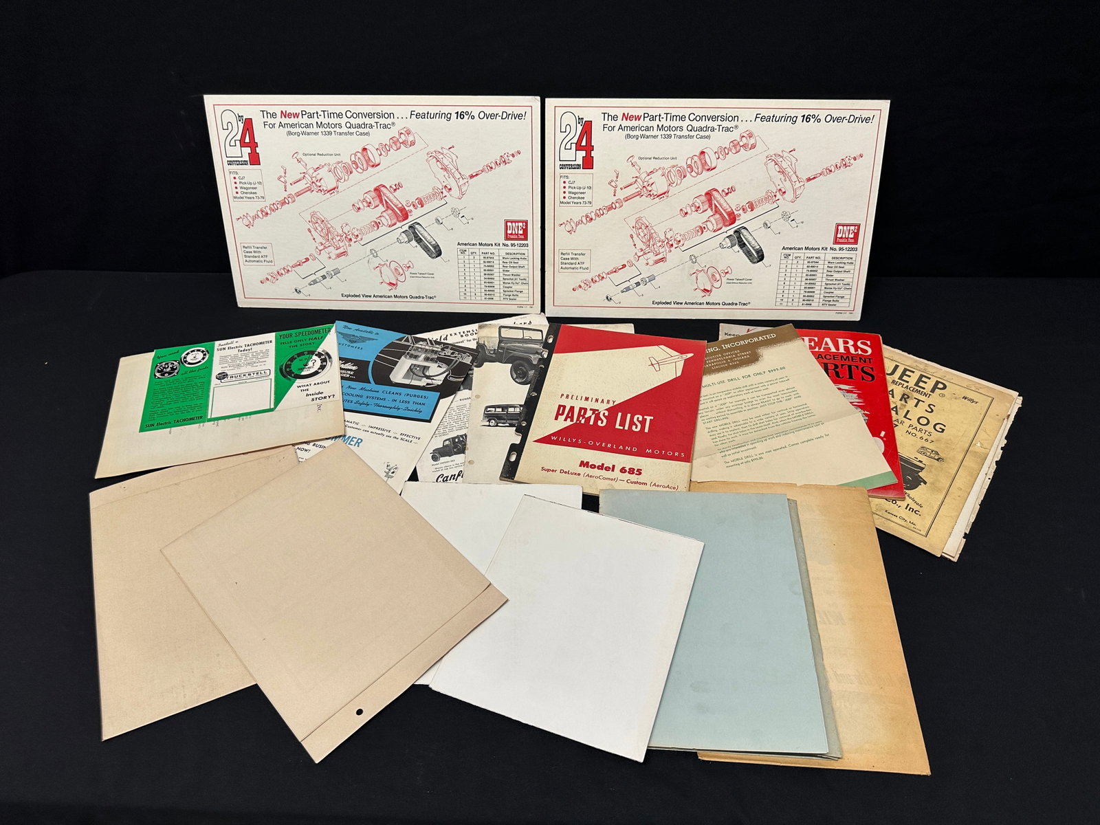JEEP AND OTHER AUTO ADVERTISING EPHEMERA: EPHEMERA AND POSTERS, AUTO AND PARTS SPEC, AUTHORIZED RETAILER, DANA 20, CHEROKEE, SPICER, SEARS PARTS BOOK FOR JEEP 1963, WILLYS-OVERLAND MODEL 685 PARTS BOOK, WILLYS PISTON RINGS AD, CANFIELD WRECKE