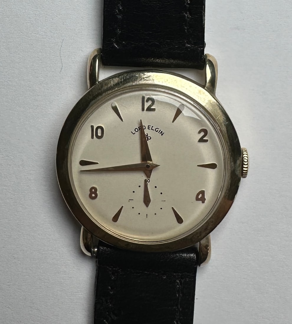 LORD ELGIN 680 GOLD WATCH: MARKED 14K GOLD, 21 JEWEL, FRENCH CALF BAND, RUNNING.