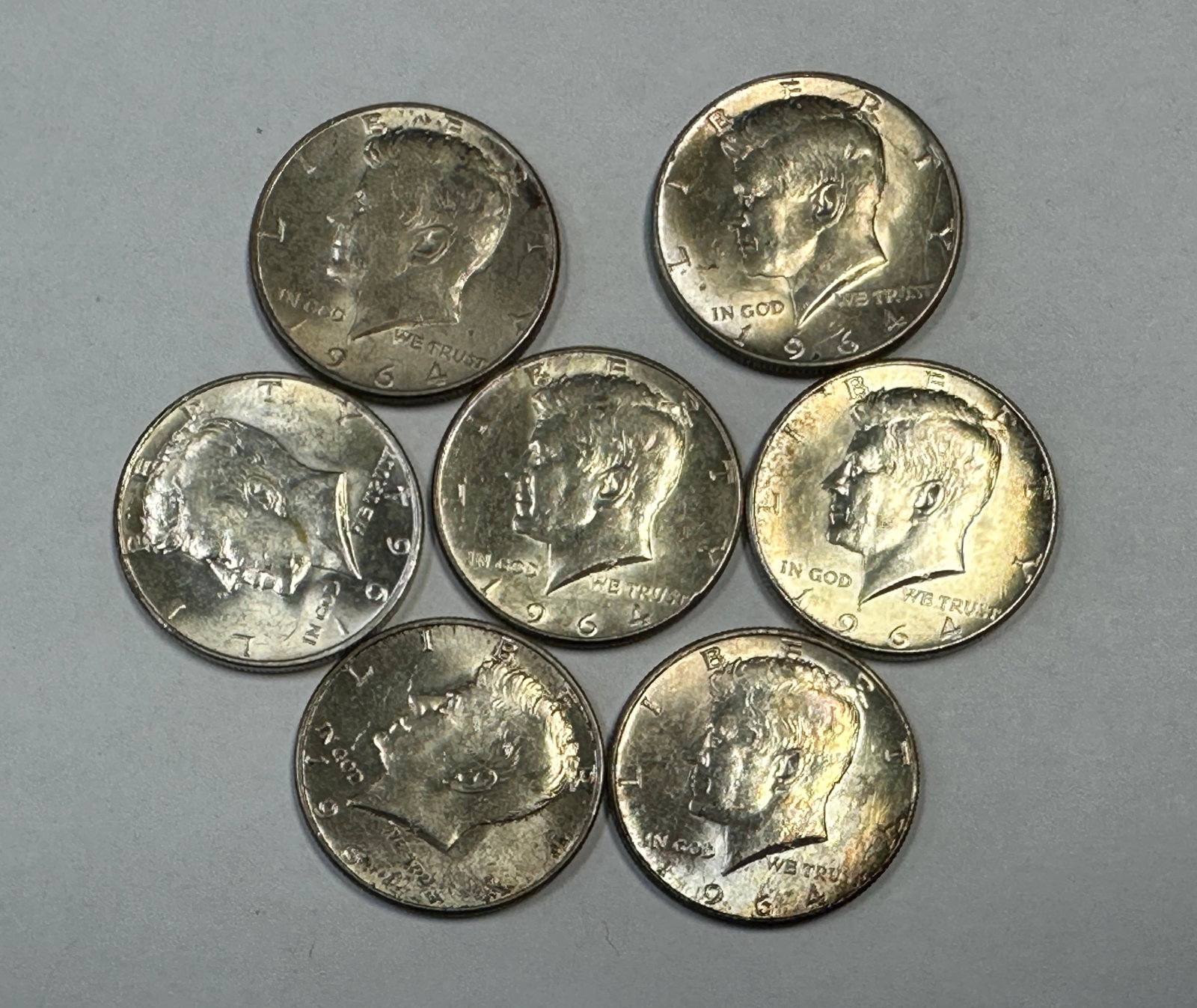 1964 KENNEDY HALF DOLLAR COLLECTION: LOT OF SEVEN CIRCULATED 90% SILVER HALF DOLLARS