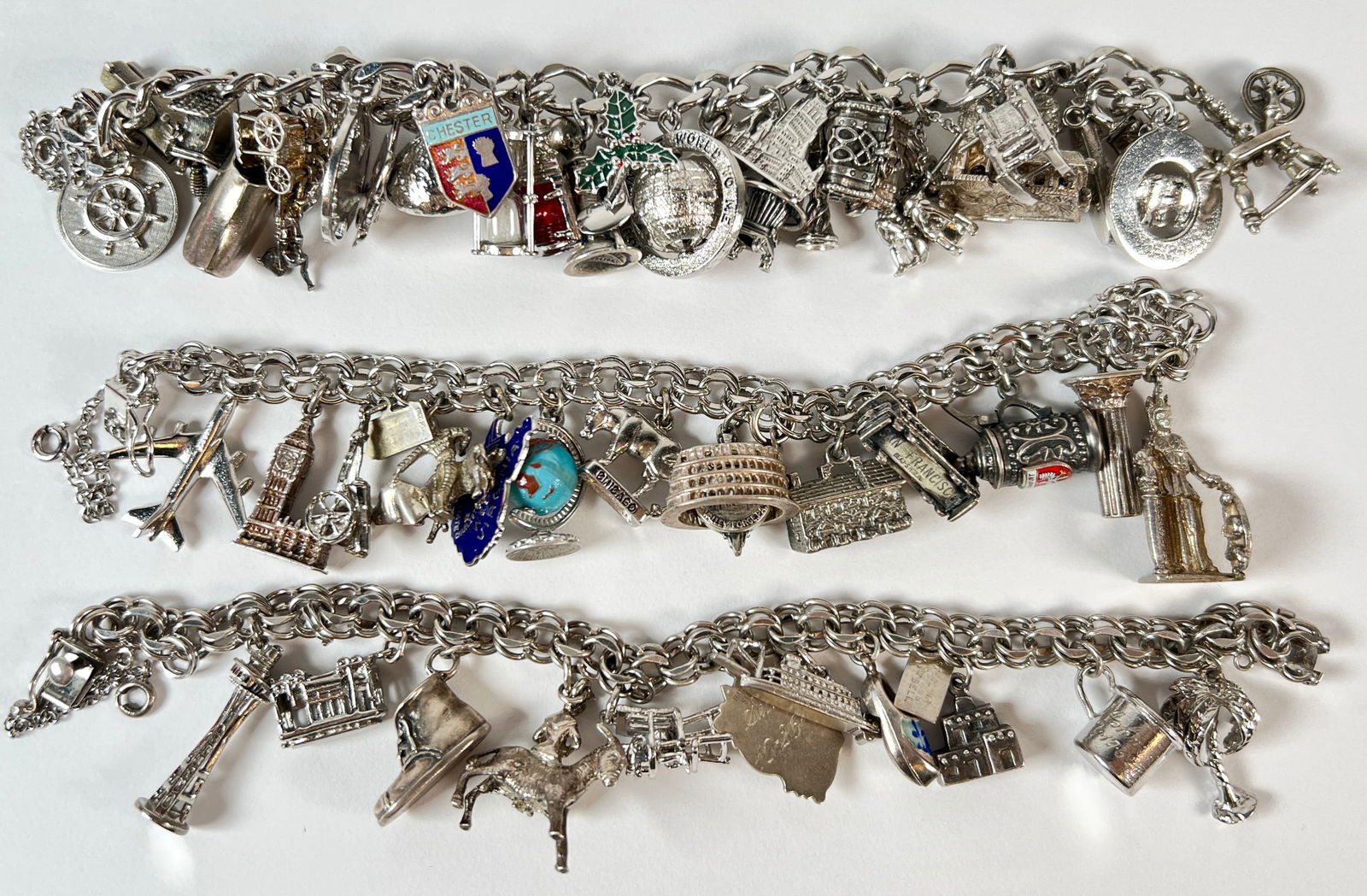 STERLING SILVER CHARM BRACELETS: 239 GRAMS TOTAL WEIGHT