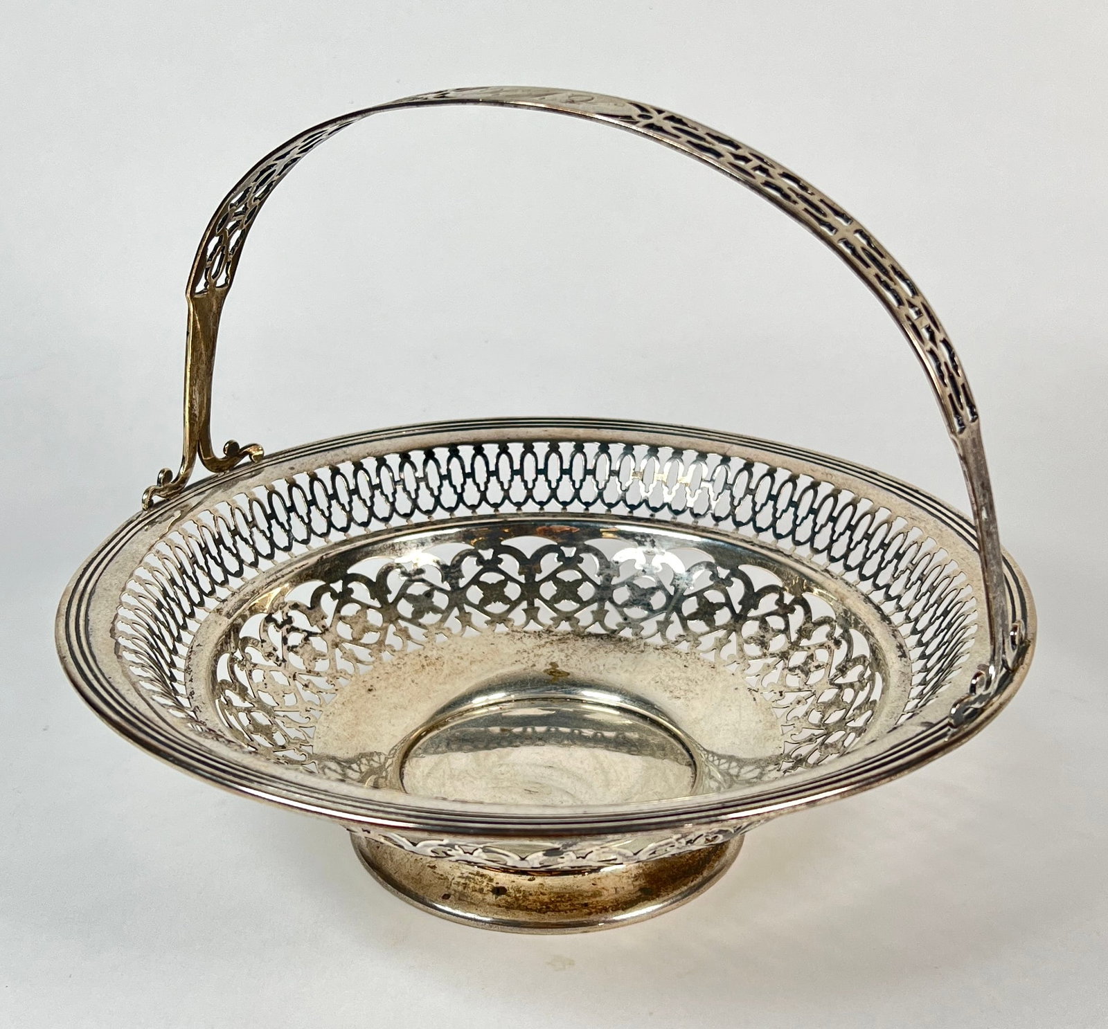 G.W. SPIER STERLING SILVER BASKET: RETICULATED DESIGN WITH HANDLE, 340 GRAMS TOTAL WEIGHT. 10"X8"